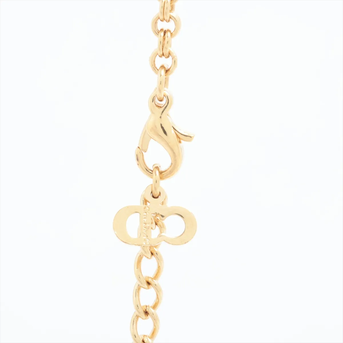 CD logo necklace, gold plated with rhinestones. Shows signs of wear, — view 3