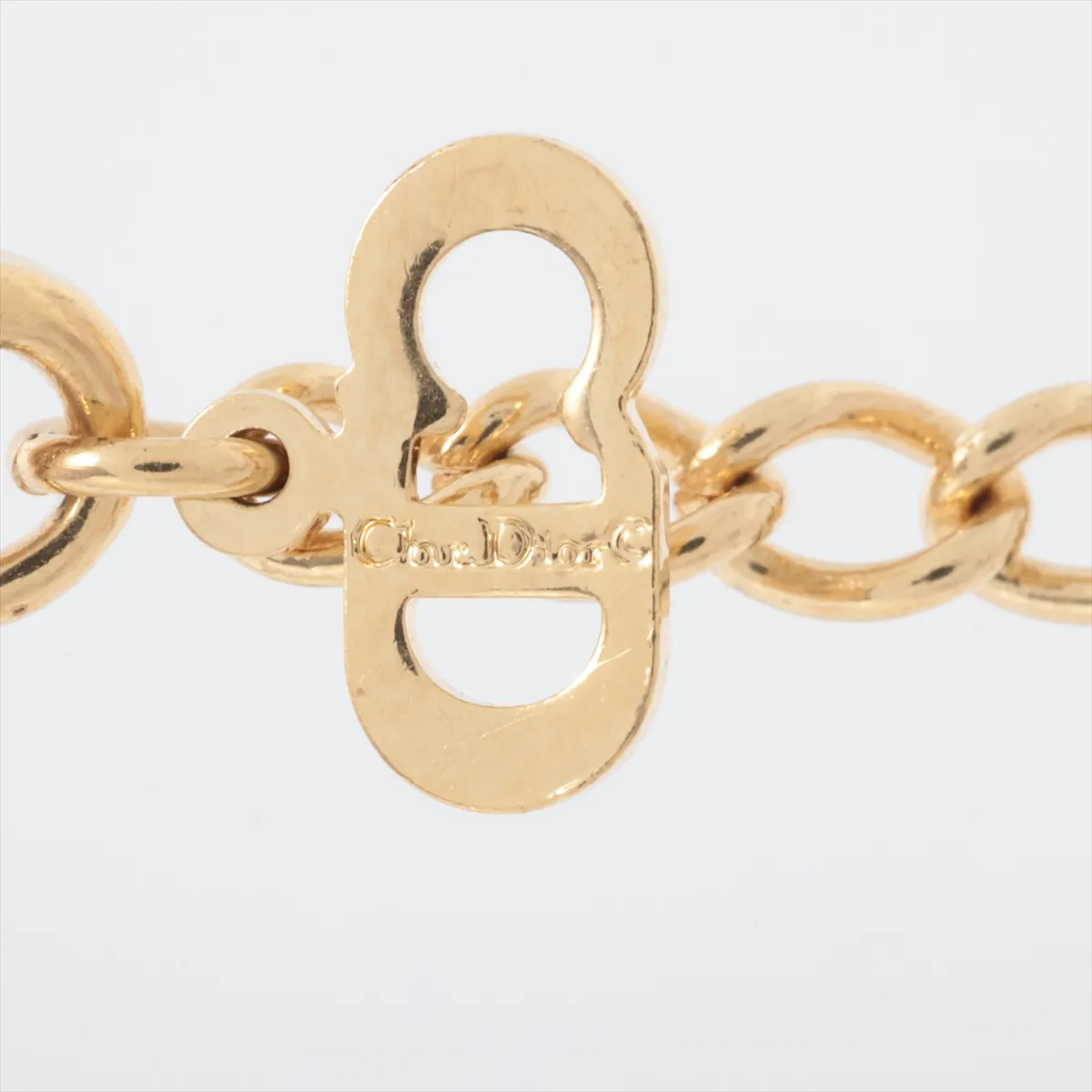 CD logo necklace, gold plated with rhinestones. Shows signs of wear, — view 4