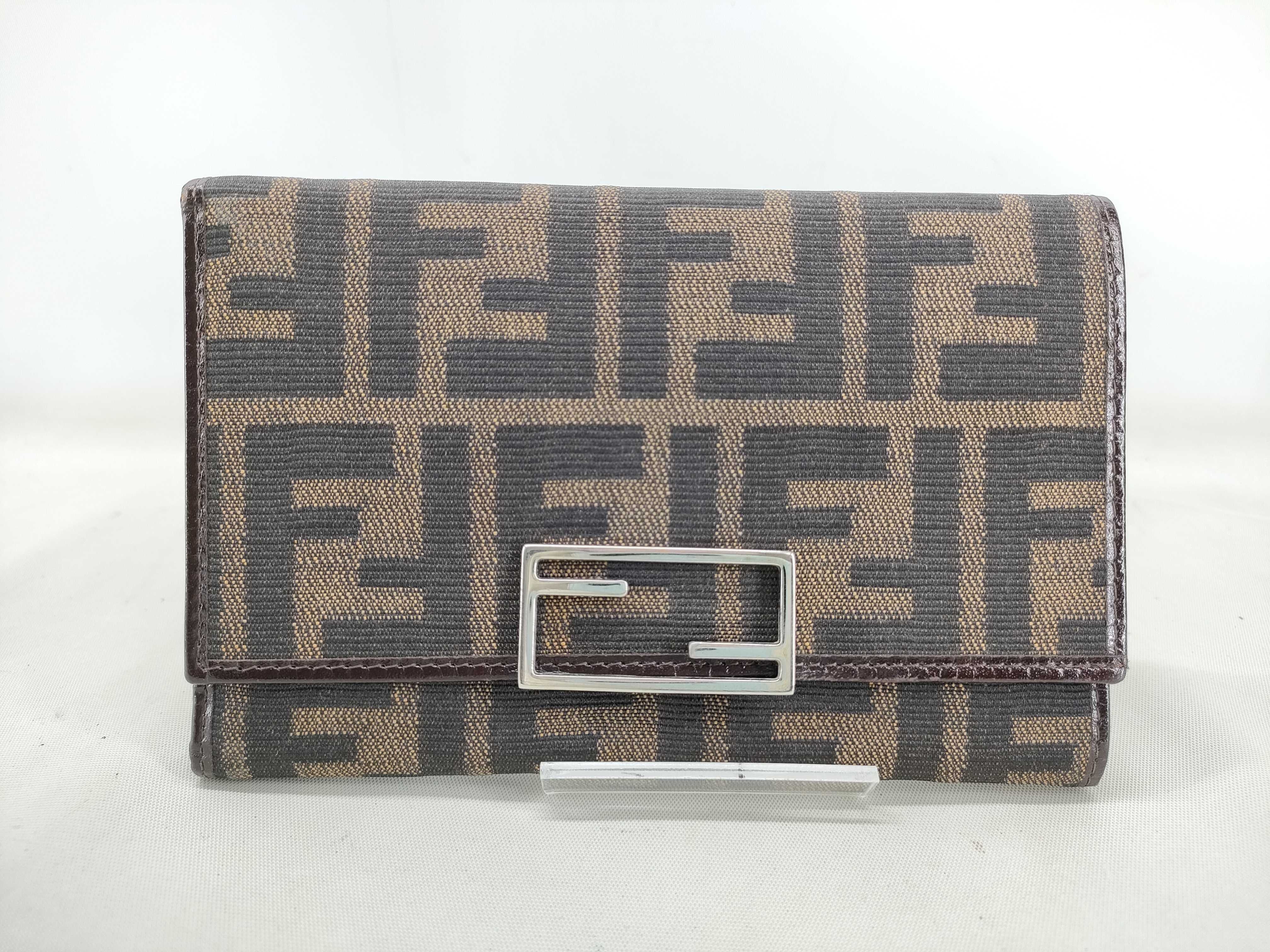 Zucca pattern trifold wallet, brown tones, canvas leather, silver hardware. (Item No. 07 15829 991)