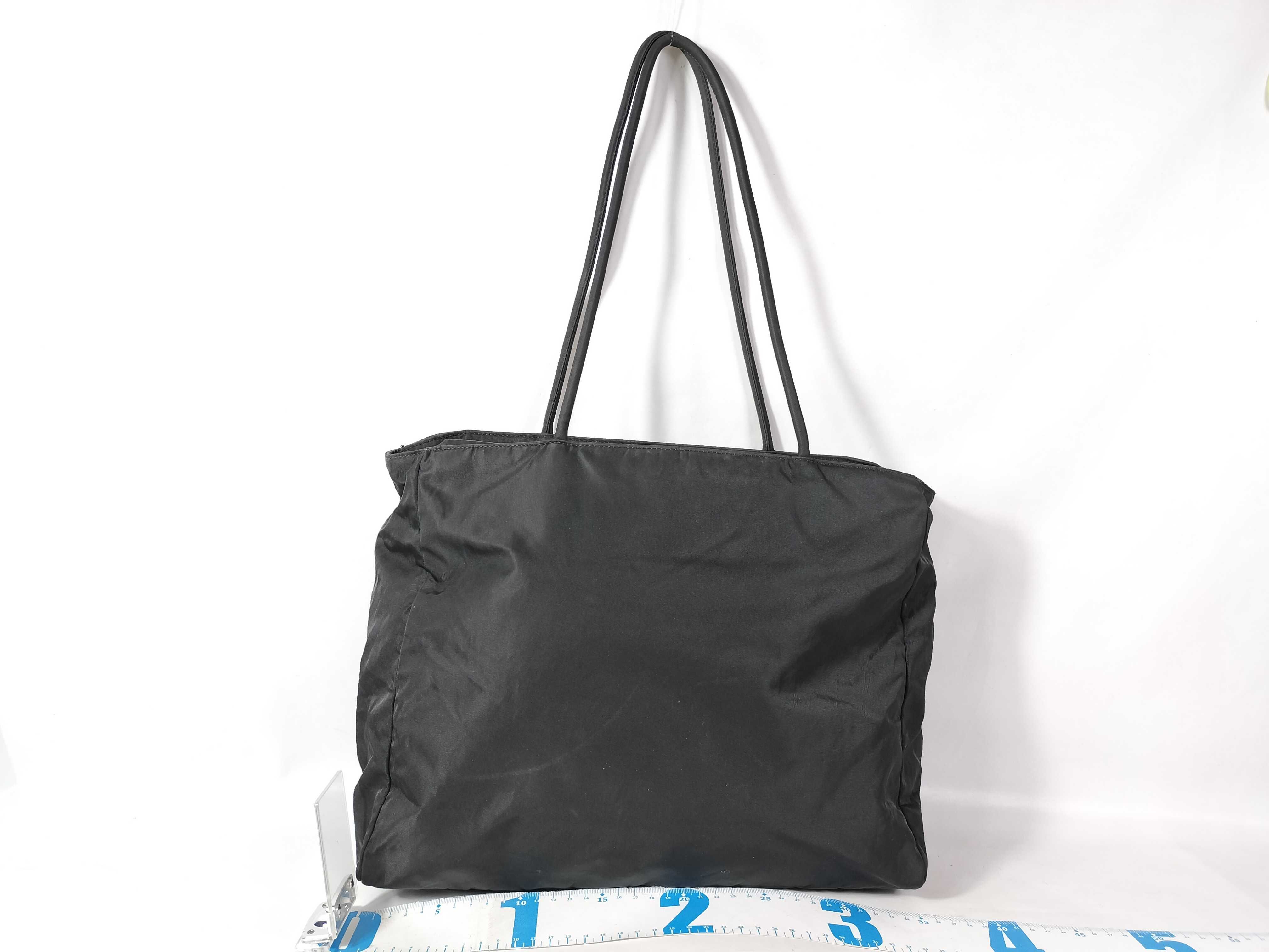 nylon tote bag (white, no tag) and nylon tote bag (black, with triangular logo plate). — view 2