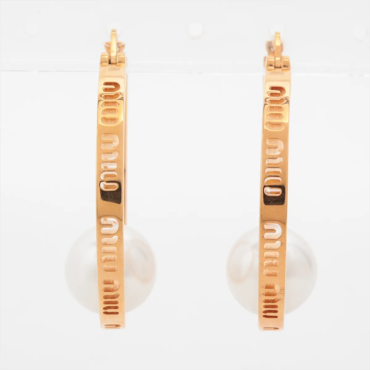 earrings (for both ears), gold-plated with faux pearls. Shows wear, tarnishing, and stains. — view 2