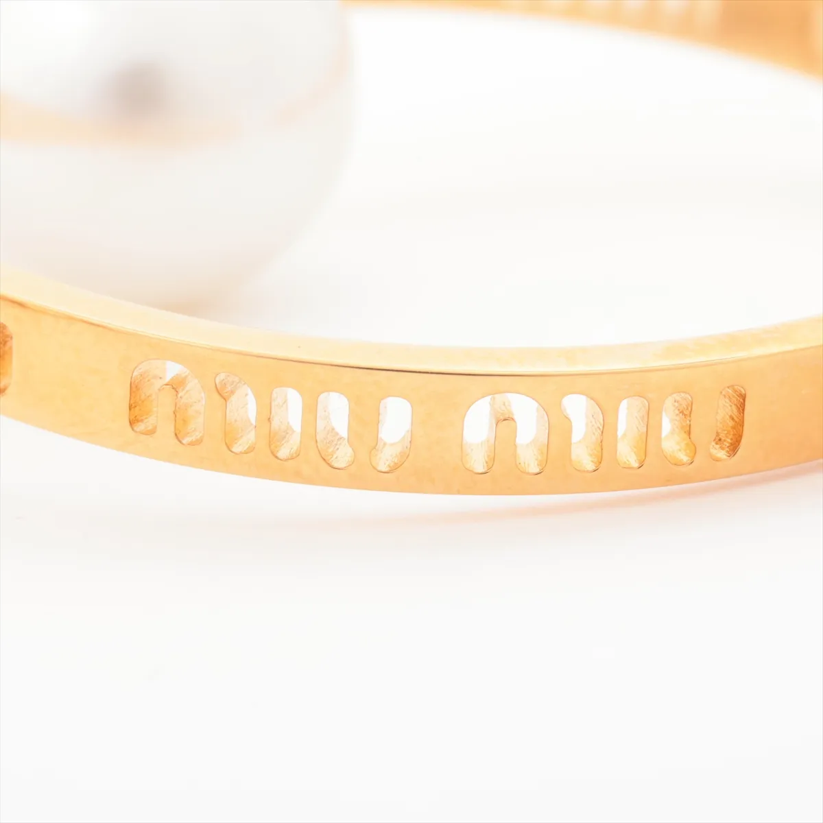earrings (for both ears), gold-plated with faux pearls. Shows wear, tarnishing, and stains. — view 5