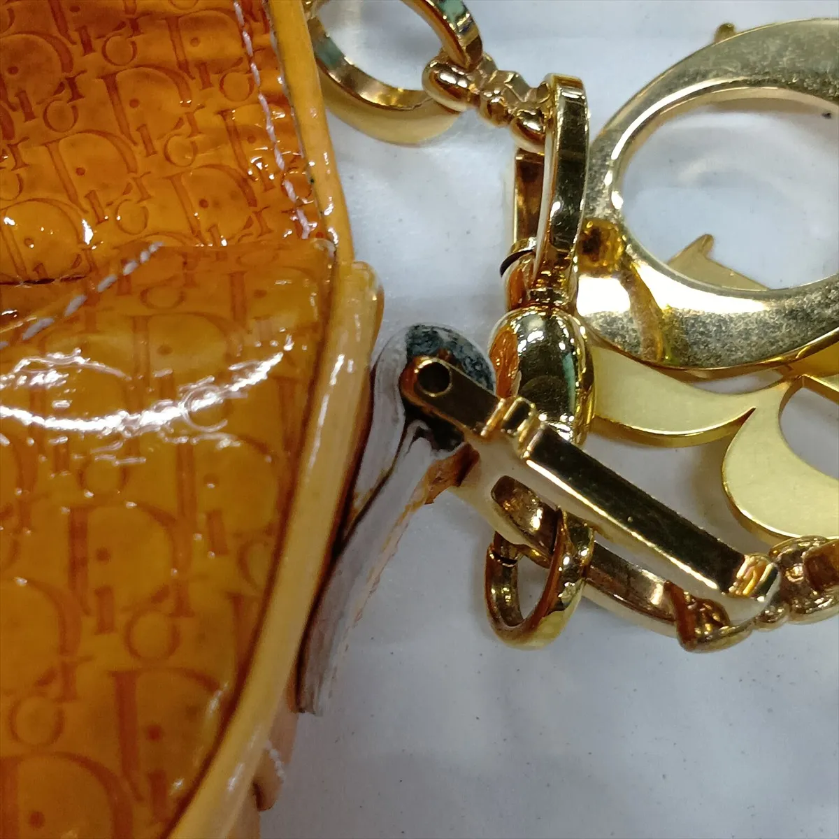 Trotter Saddle Patent Leather Clutch Bag, Orange, Charm partially missing. — view 13