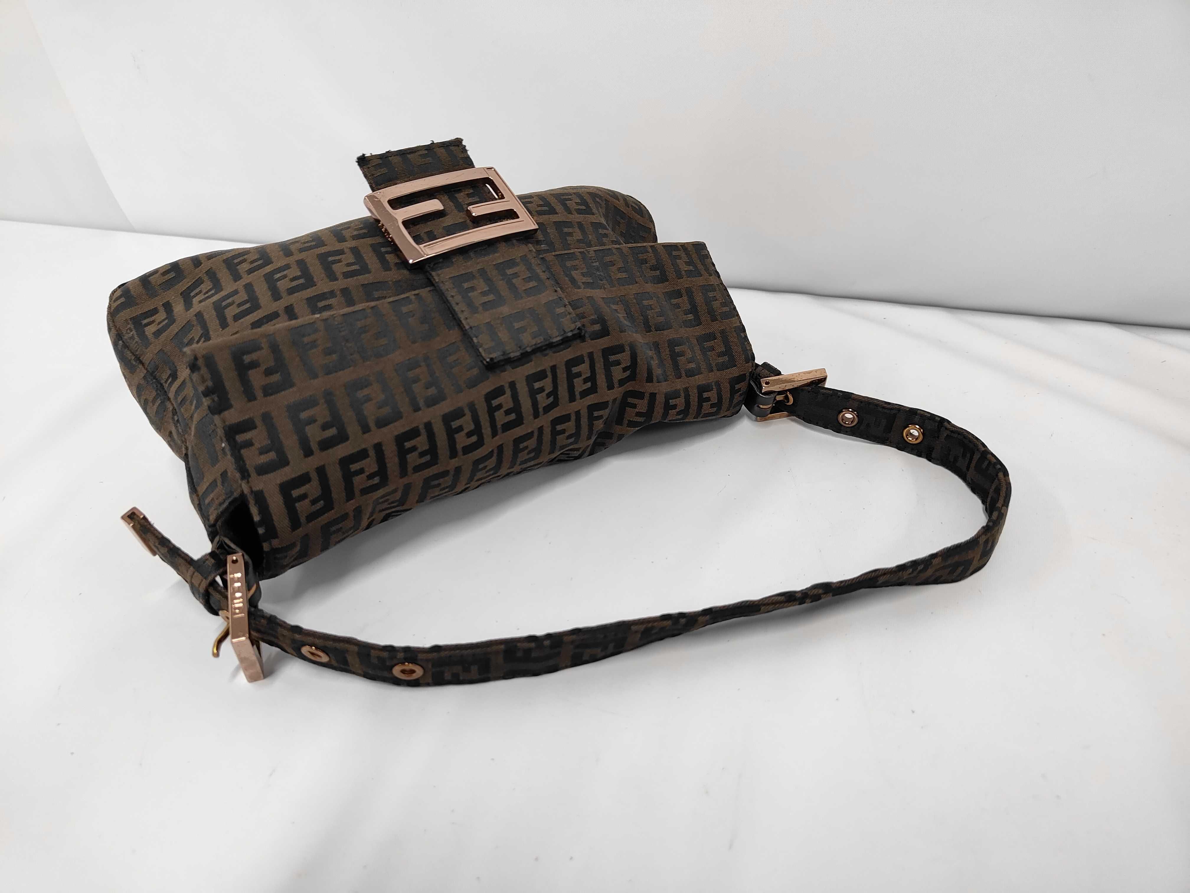 Baguette bag in dark brown/black zucchino canvas with gold hardware. — view 5