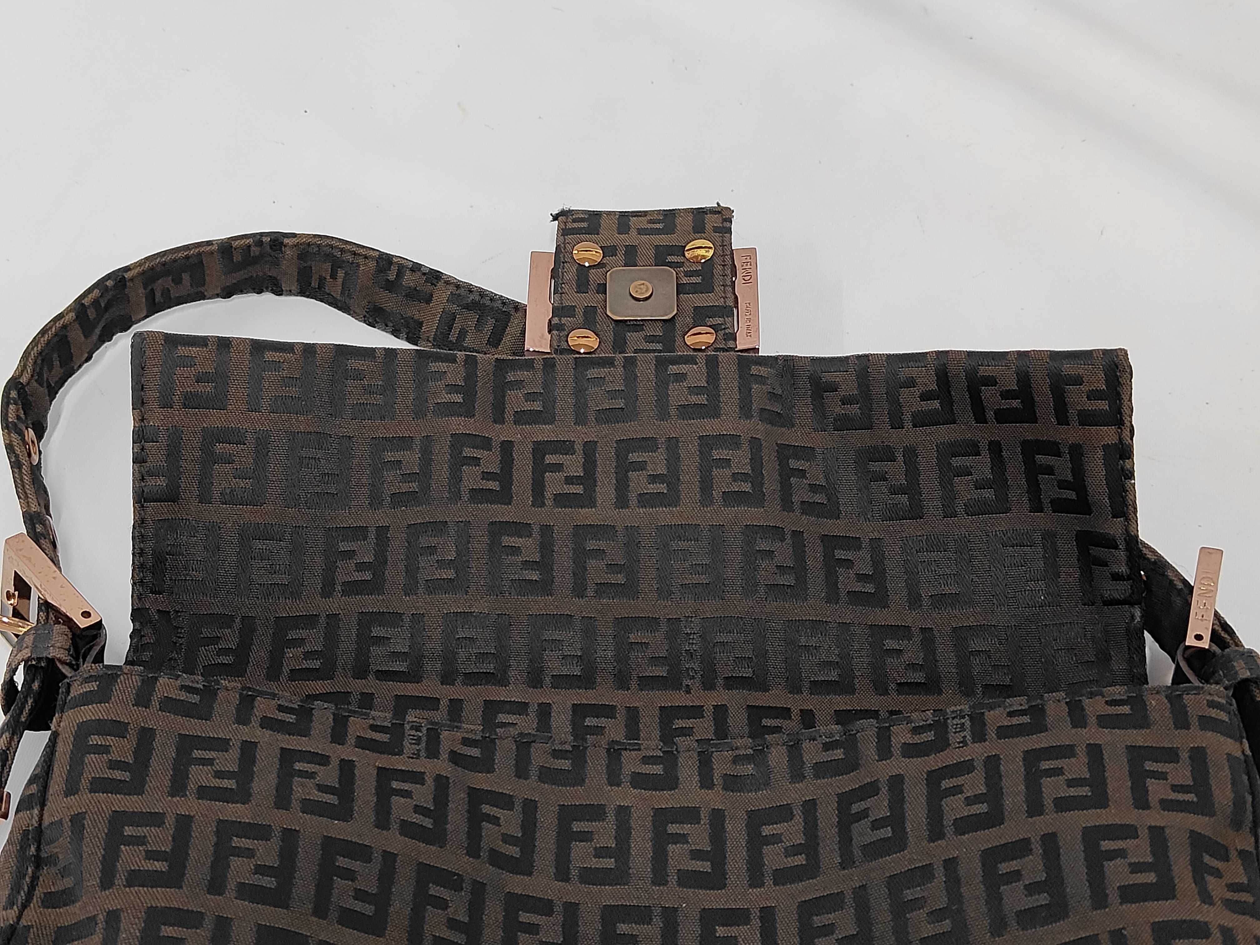 Baguette bag in dark brown/black zucchino canvas with gold hardware. — view 10