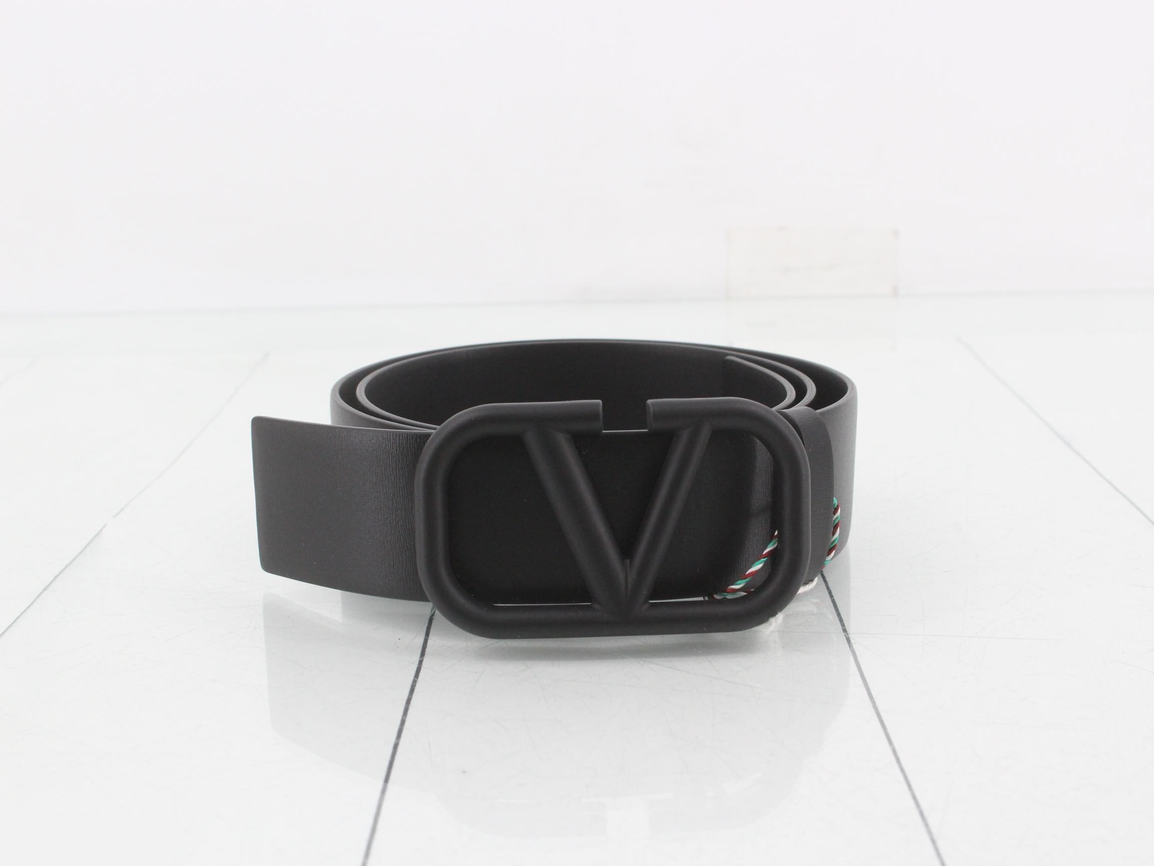 Leather belt, unused, stored item, black.