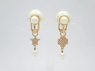 Gold earrings with stones and pearls.