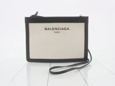 Navy pochette, ivory, black canvas