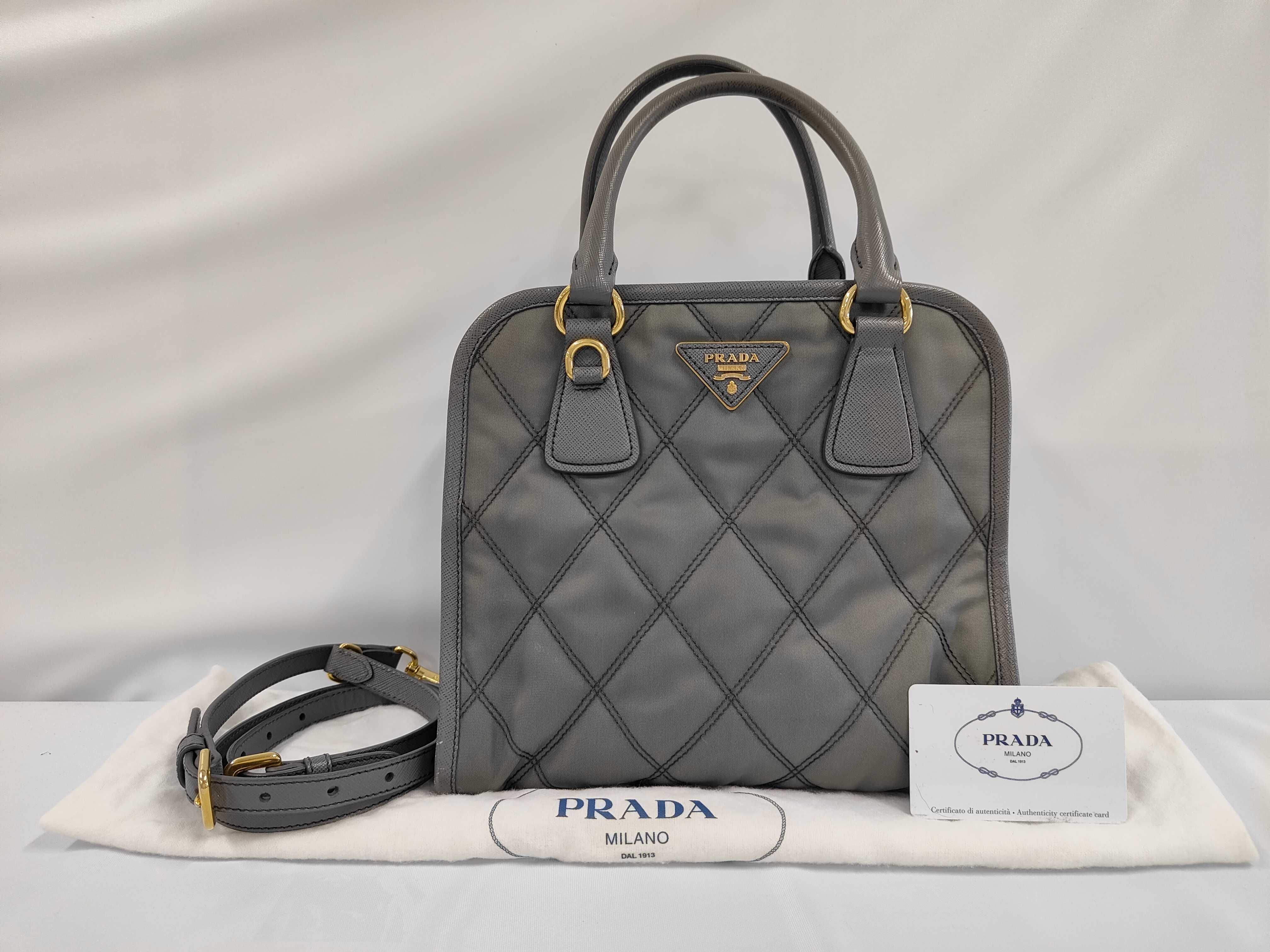 quilted nylon and leather 2-way handbag 1BA100. Accessories: dust bag, shoulder strap.