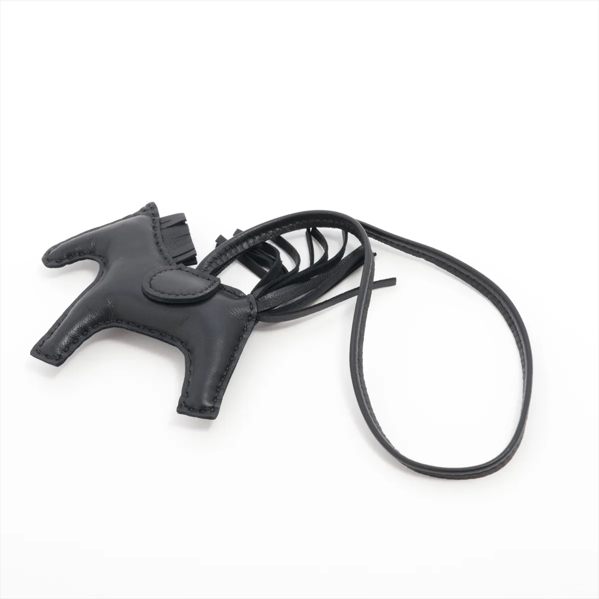 Rodeo Charm PM, G stamp: 2026. Charm in Agneau Milo Noir leather. Shows signs of wear,