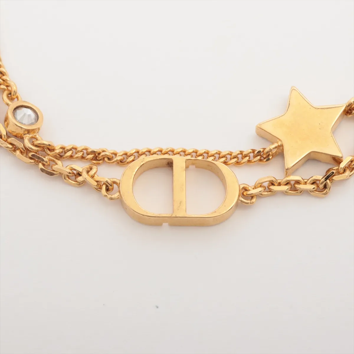 Petit CD bracelet, gold-plated with rhinestones. Shows signs of wear including — view 3