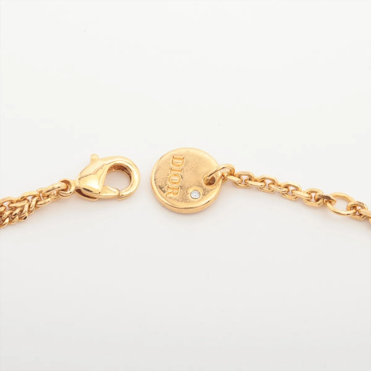 Petit CD bracelet, gold-plated with rhinestones. Shows signs of wear including — view 4