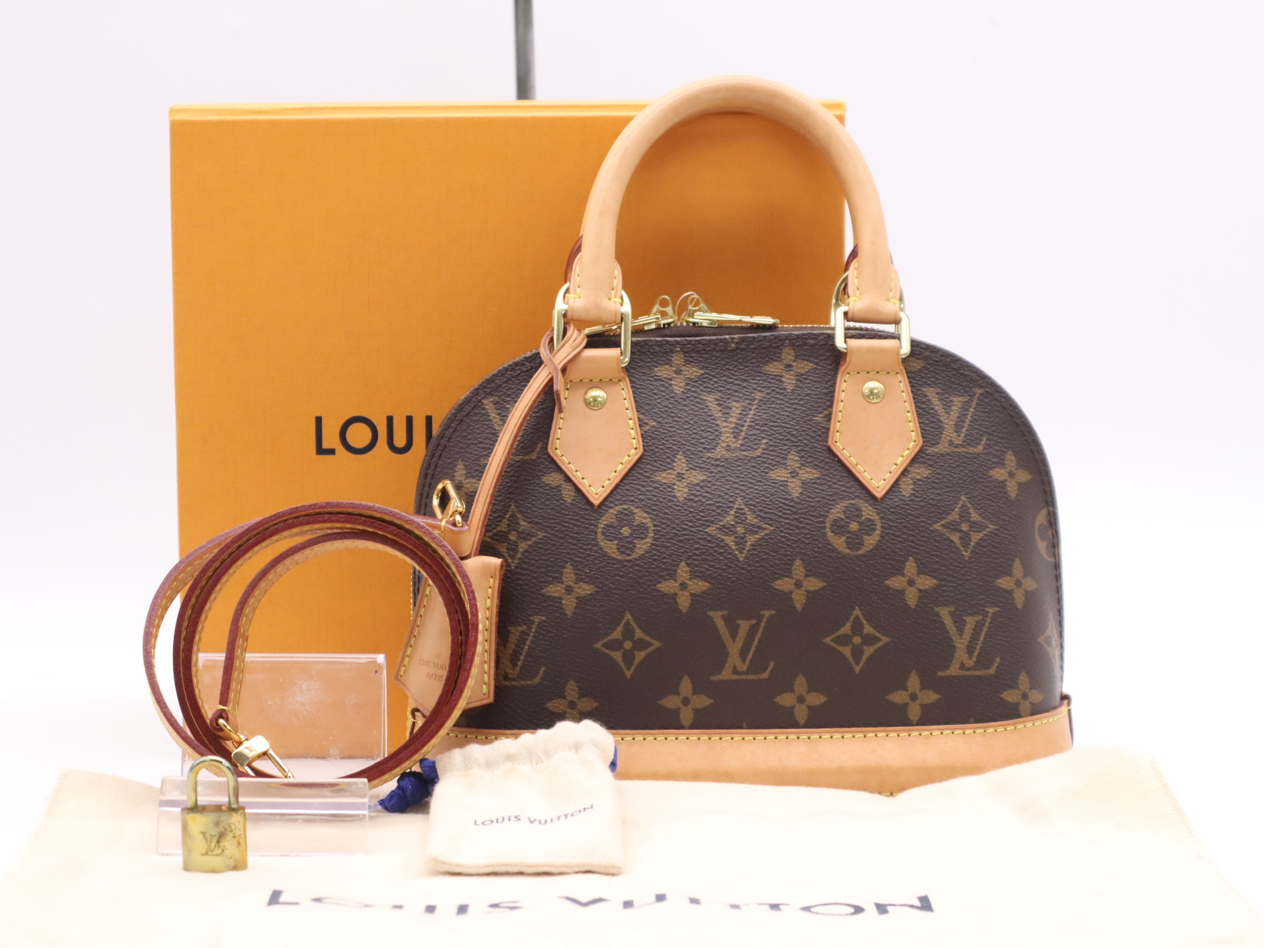 Alma BB handbag with shoulder strap, padlock, 2 keys, clochette, dust bag, small dust bag, and box. RFID verified.