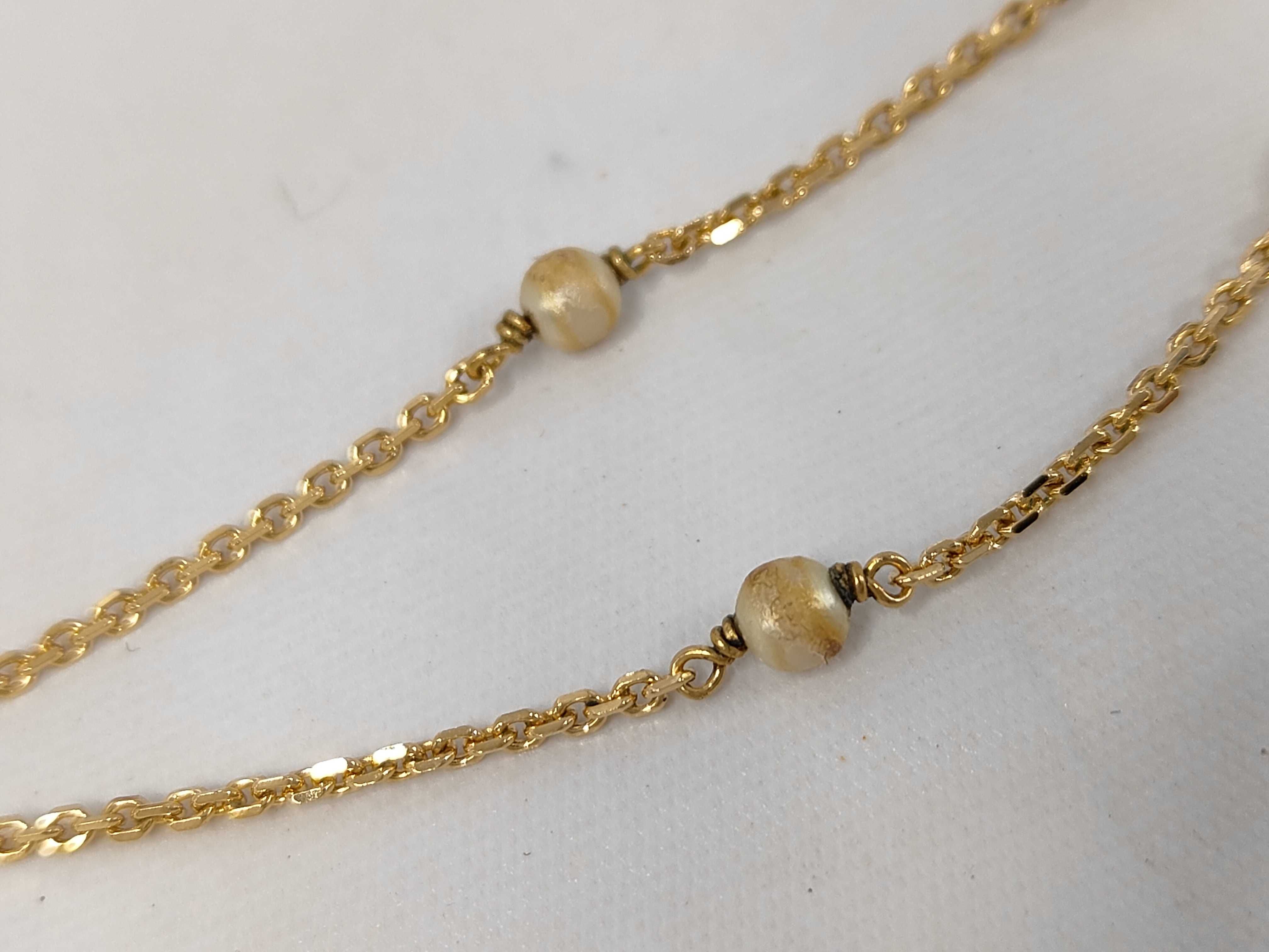 necklace with logo, pearl, and gold accents. — view 8