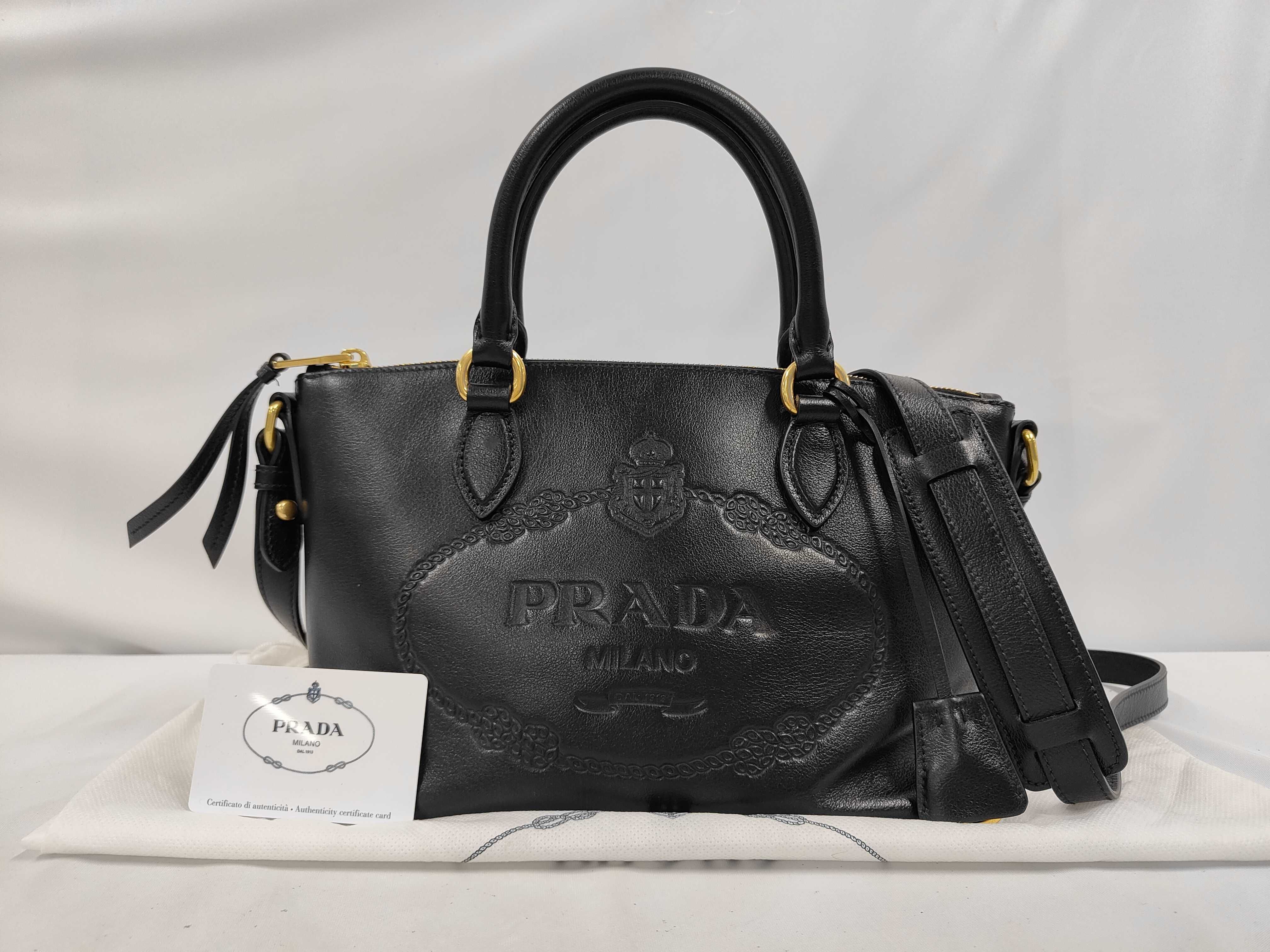 1BA111 Leather Handbag, Black with Gold Hardware, Includes Shoulder Strap, Card Holder, Charm, and Dust Bag.