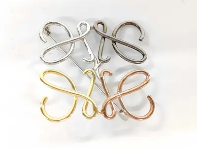 Anagram Brooch (Silver and Gold Hardware)