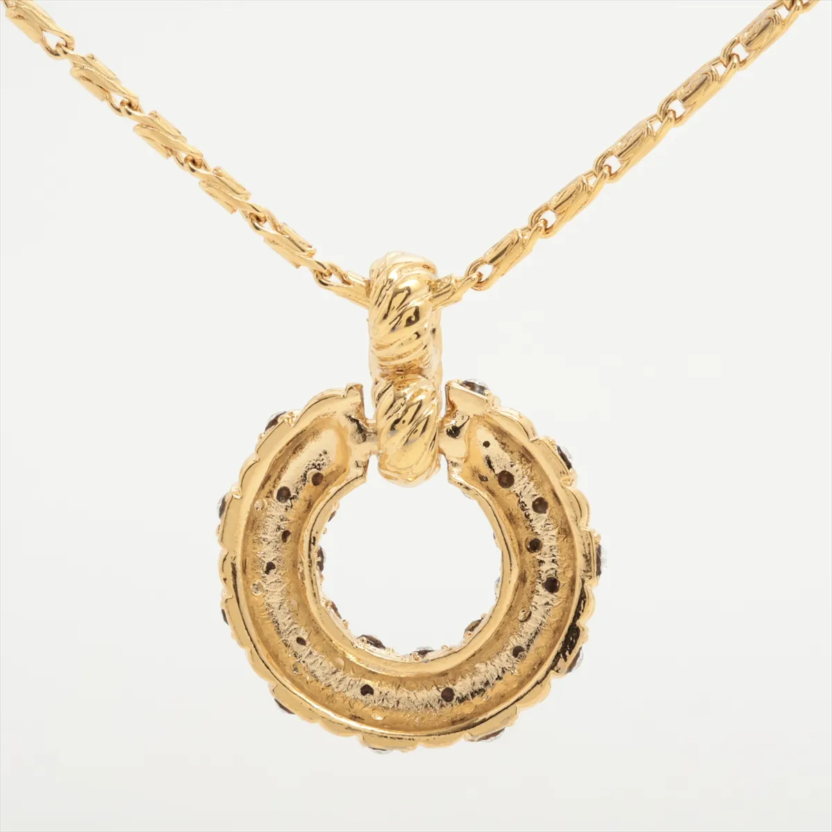 necklace, gold plated with rhinestones. Shows signs of wear, tarnishing, and stains. — view 2