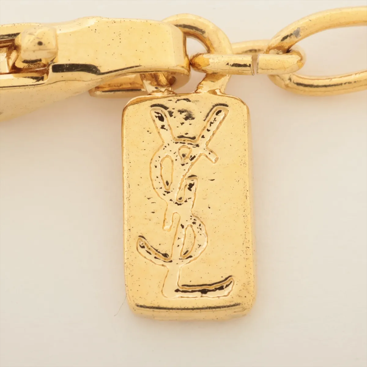 necklace, gold plated with rhinestones. Shows signs of wear, tarnishing, and stains. — view 4