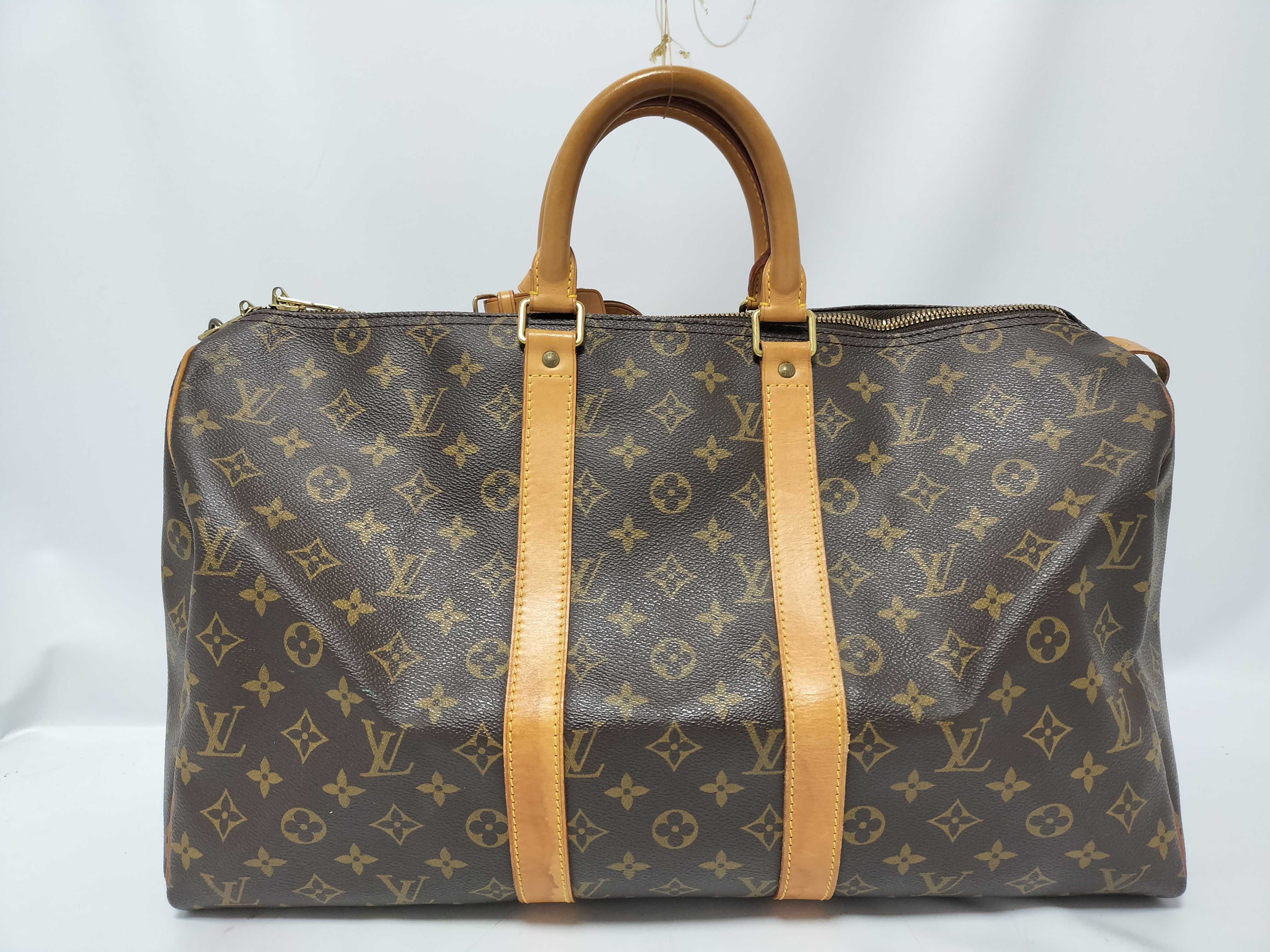 Monogram LOUIS_VUITTON M41428 Keepall 45 SP0936 Boston bag with padlock, name tag, and handle strap.