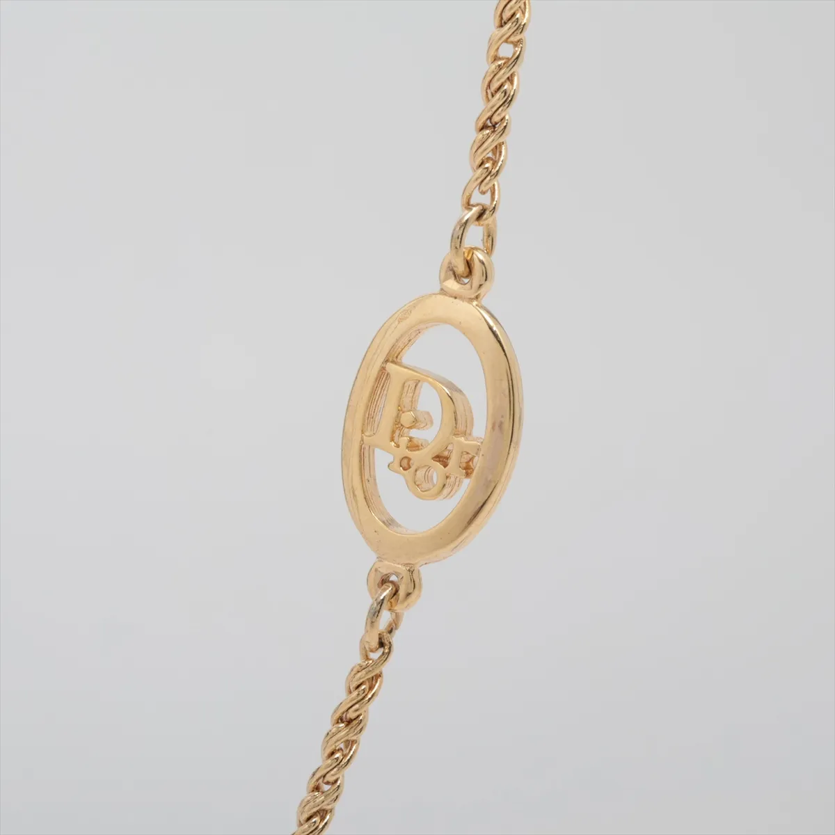 logo necklace, GP gold. Shows — view 2