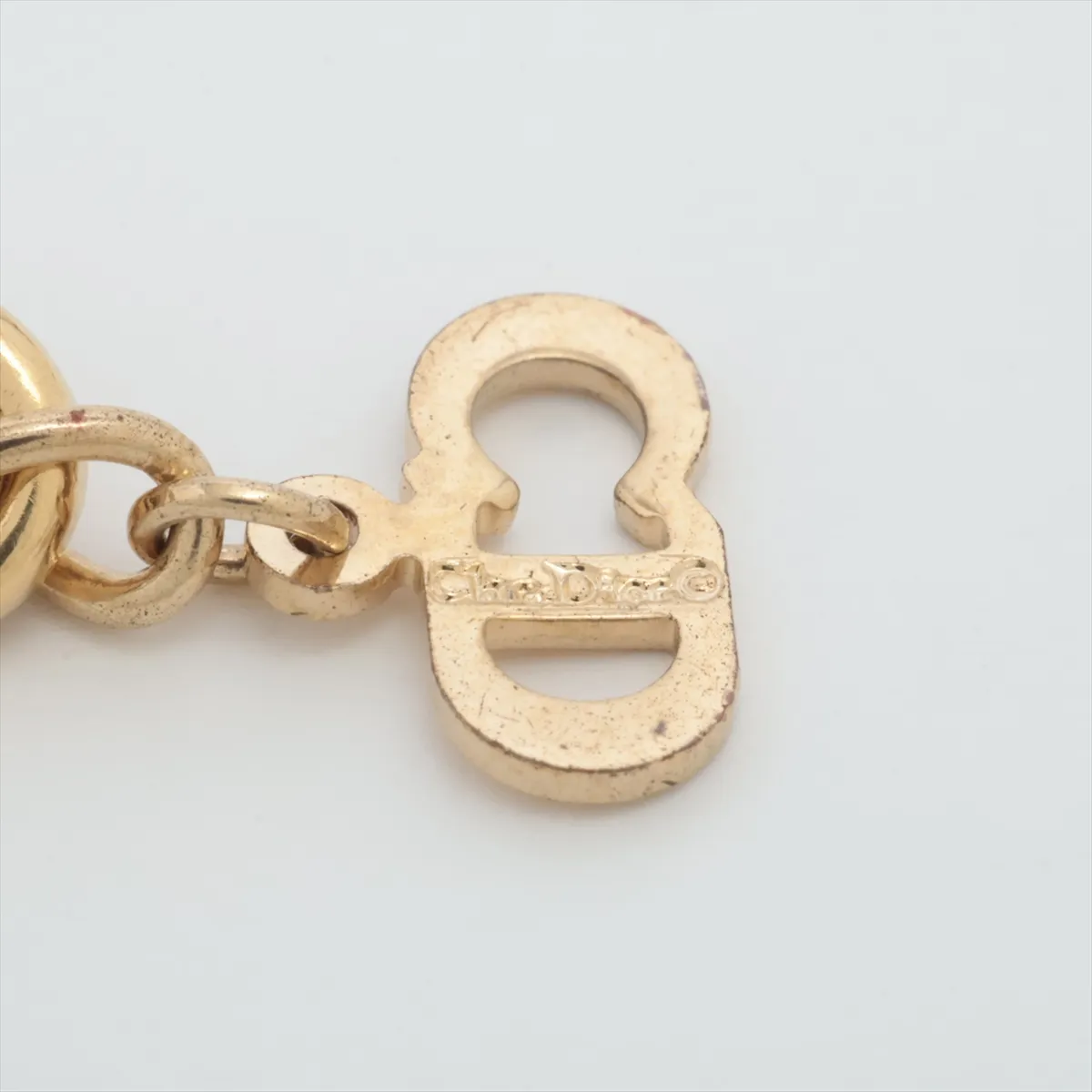CD logo necklace, gold plated with rhinestones. Shows signs of wear, — view 4