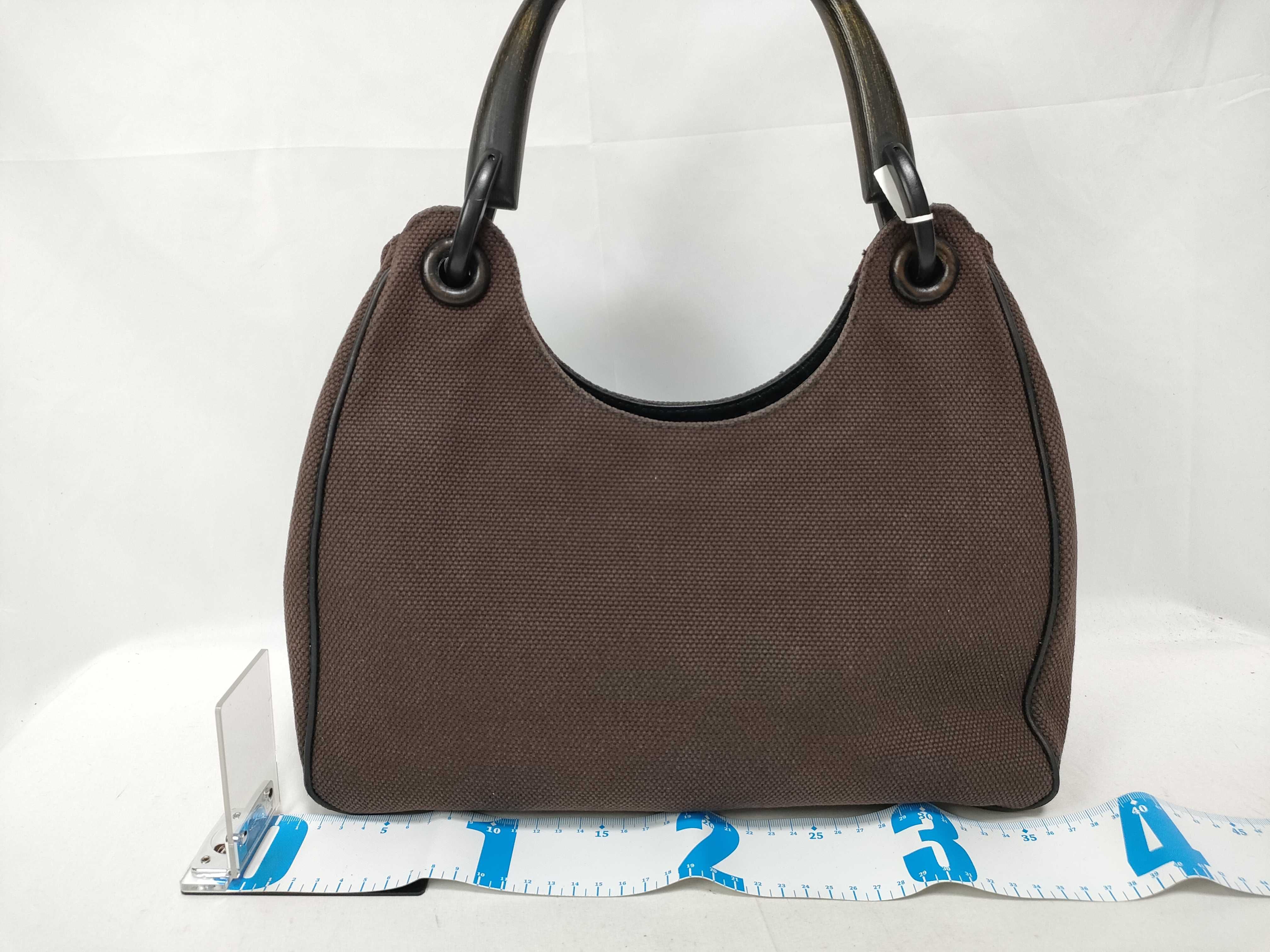 Brown GG Canvas Wooden-Handle Wrist Bag — view 2