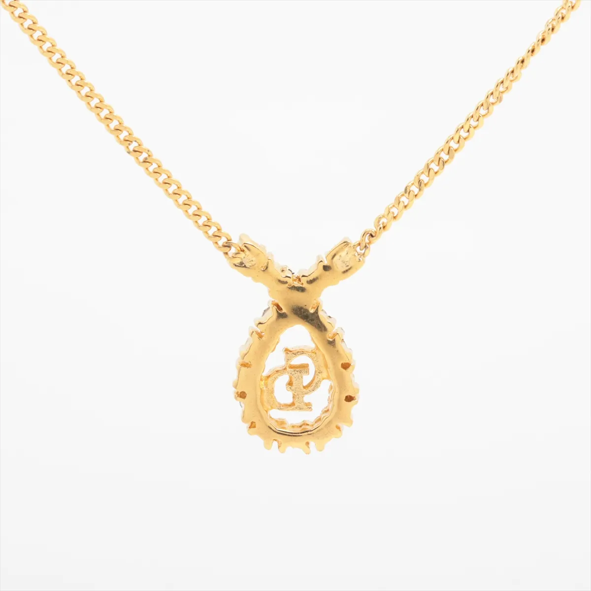 CD logo necklace, gold plated with rhinestones. Shows signs of wear, including — view 2