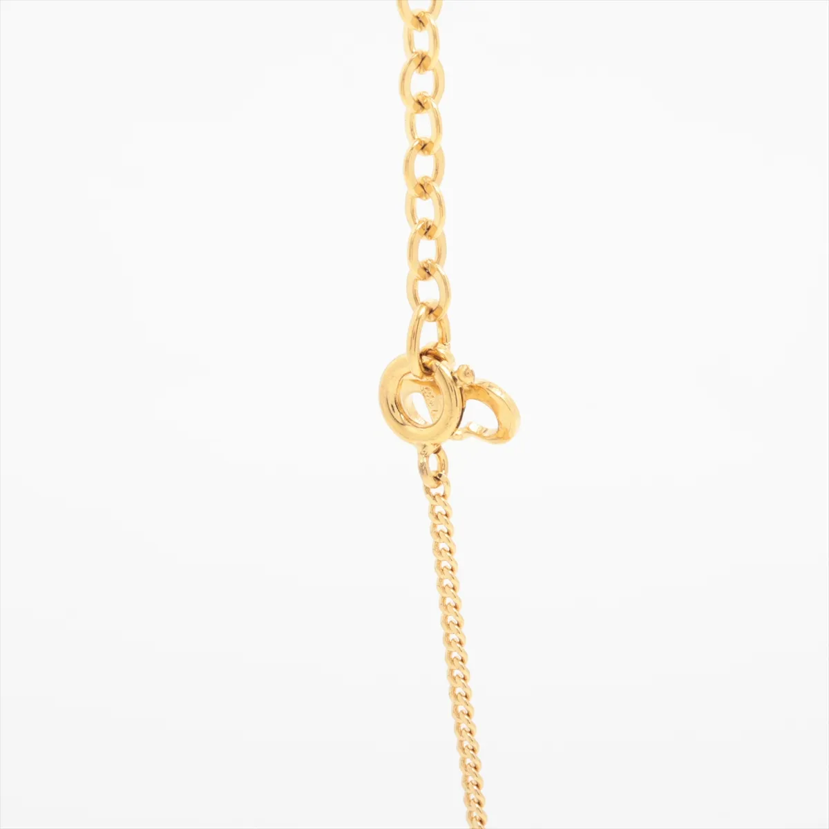 CD logo necklace, gold plated with rhinestones. Shows signs of wear, including — view 3