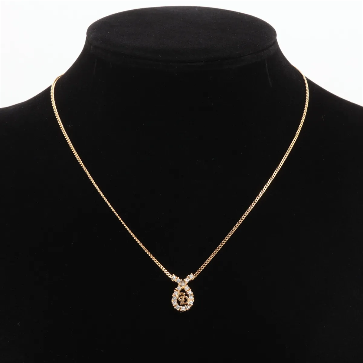 CD logo necklace, gold plated with rhinestones. Shows signs of wear, including — view 5