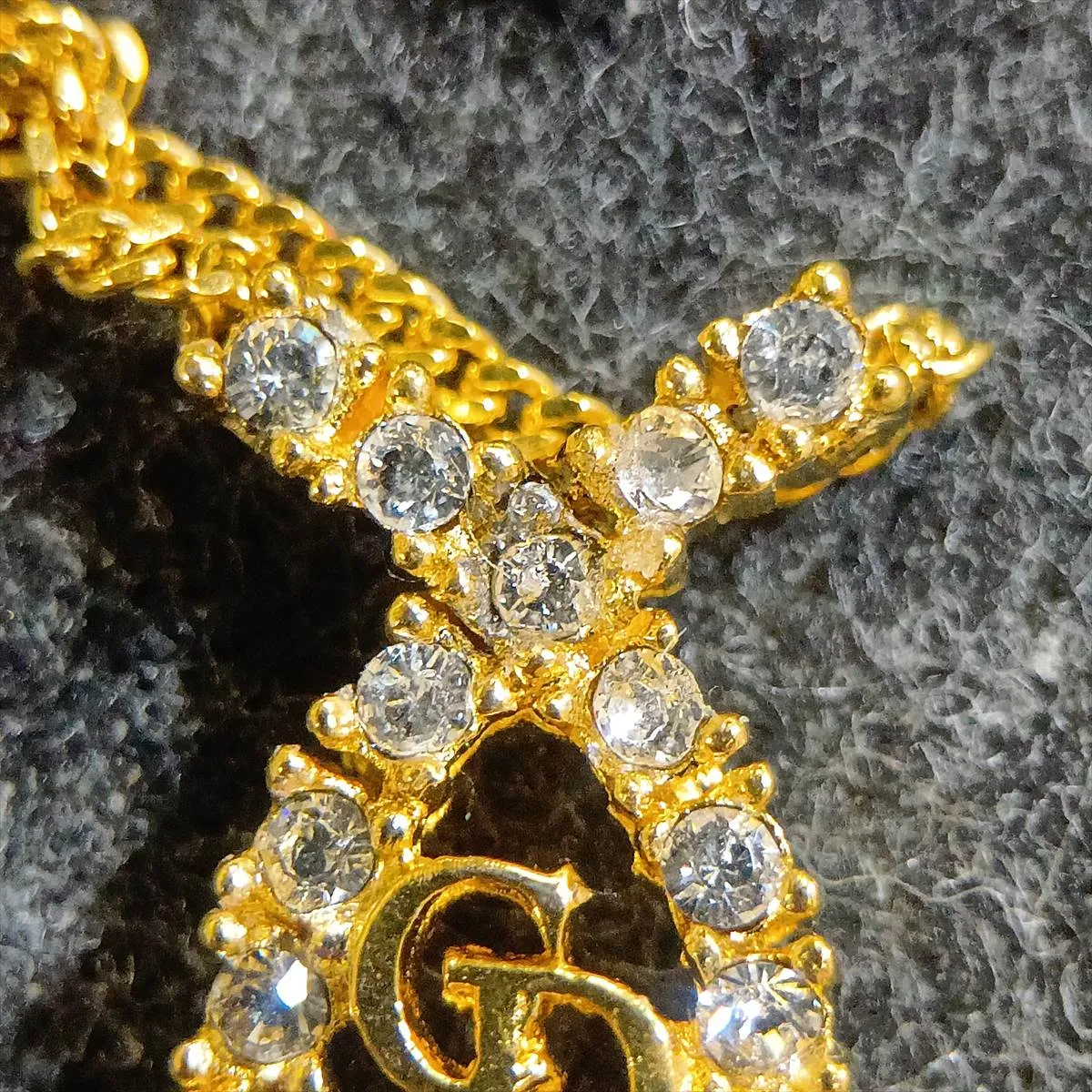 CD logo necklace, gold plated with rhinestones. Shows signs of wear, including — view 6