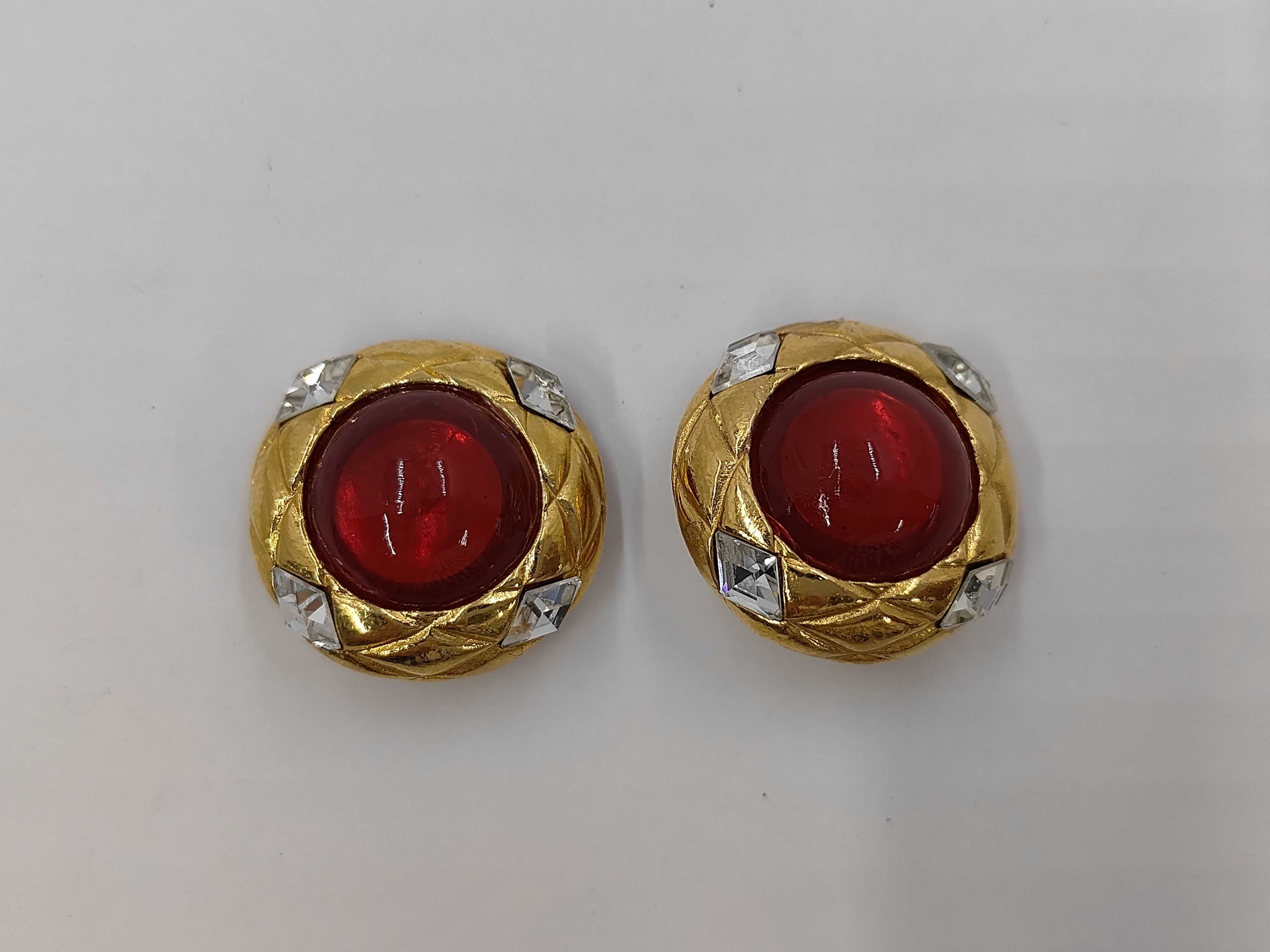 brand jewelry earrings with red stones.