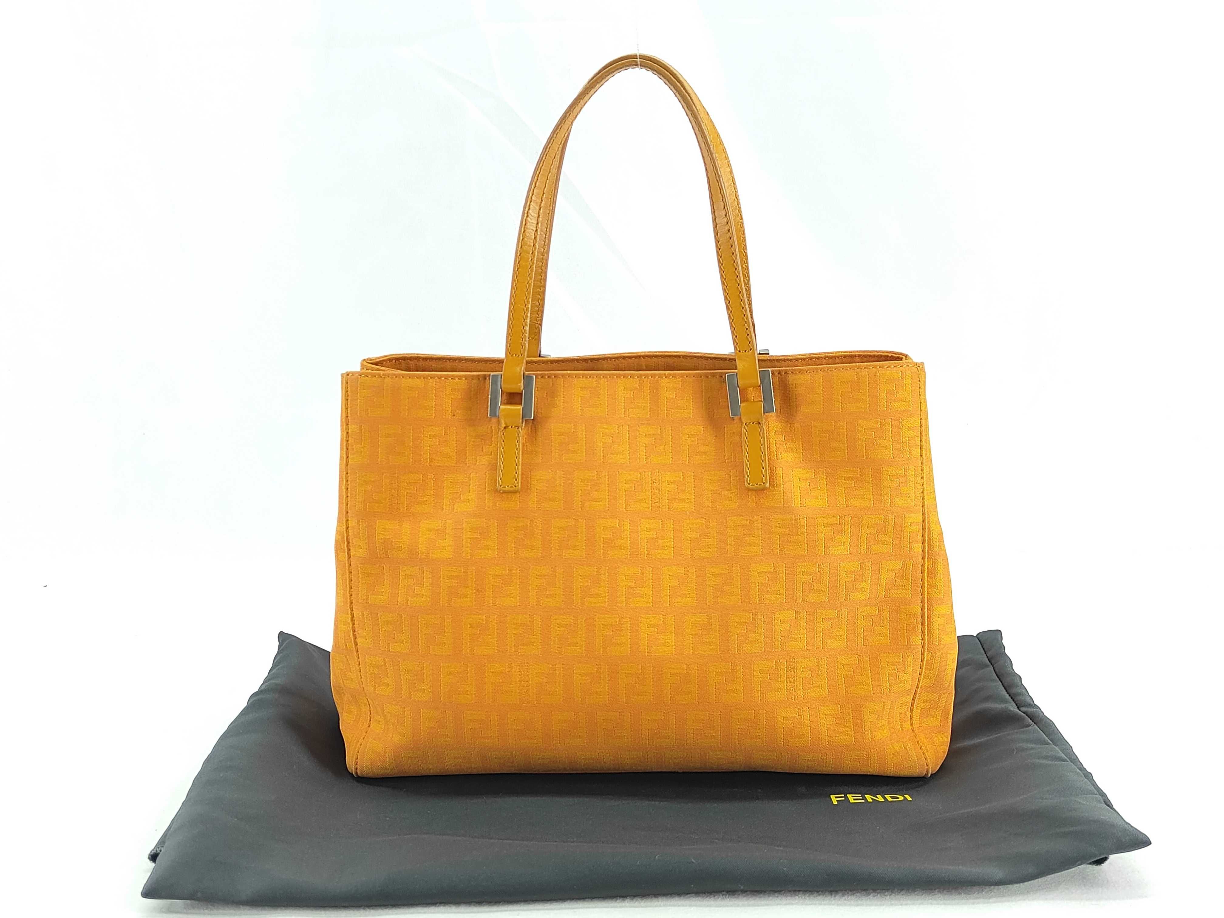 Zucca canvas and leather tote bag, orange, with tears.