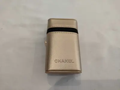 Rouge Allure lipstick with accompanying pouch and other accessories