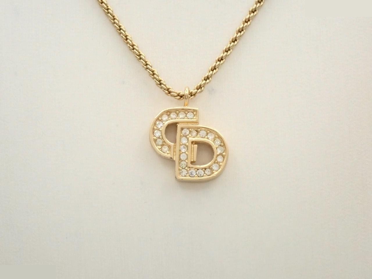 CD logo rhinestone necklace/pendant, approximately 47cm neck circumference.