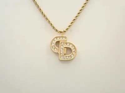 CD logo rhinestone necklace/pendant, approximately 47cm neck circumference.