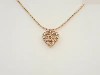 Gold necklace with stone, chain approximately 42cm long.