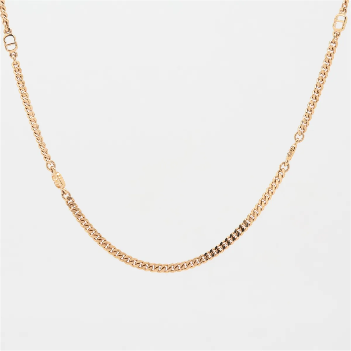 CD logo necklace, GP gold. Shows signs of wear,