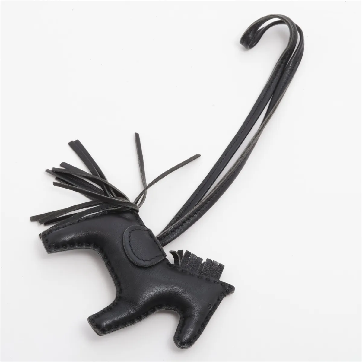 Rodeo Charm PM, Year: 2020. Charm in Agneau Milo leather, black. Shows signs of wear, including — view 2