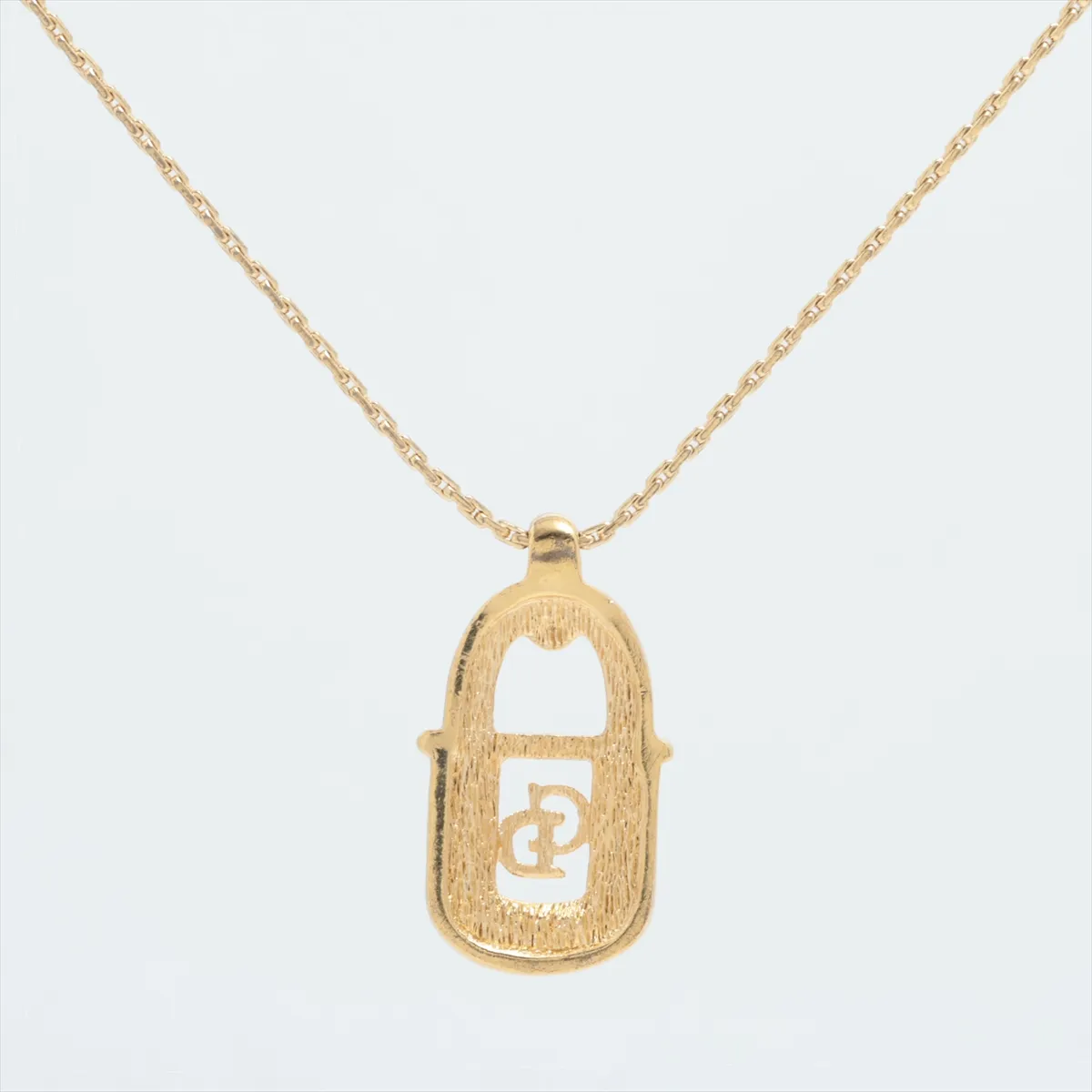 CD logo necklace, gold plated with rhinestones. Shows signs of wear, — view 2