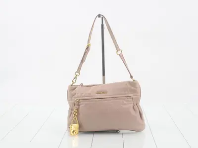 Leather shoulder bag with dust bag
