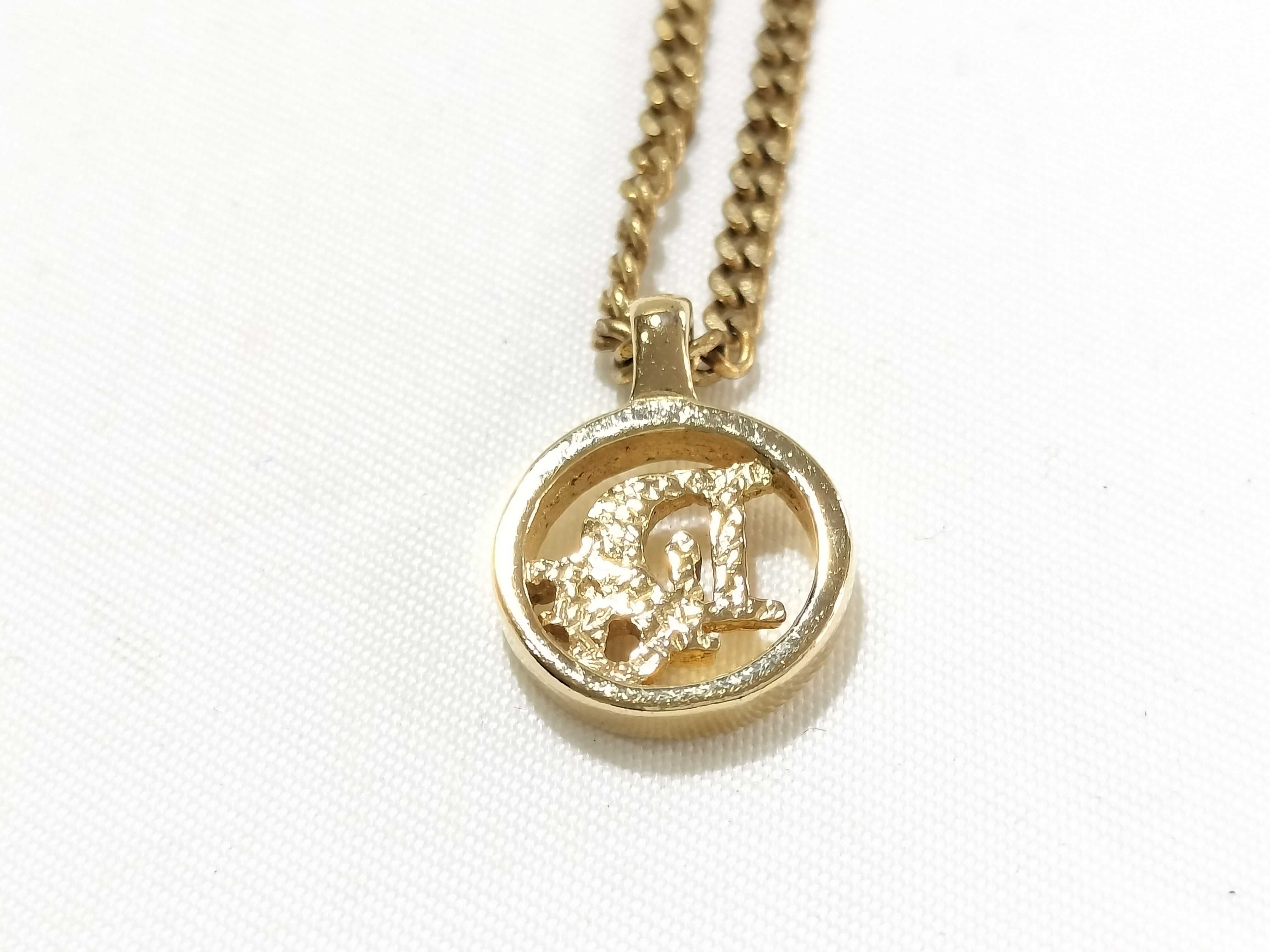necklace, gold, logo, circle, and other accessories. — view 2