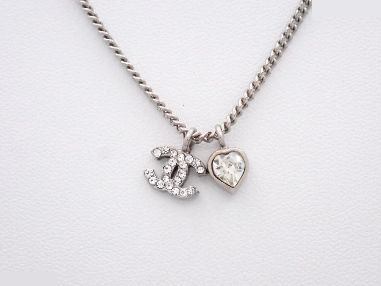 Necklace with markings; chain approximately 43cm long.