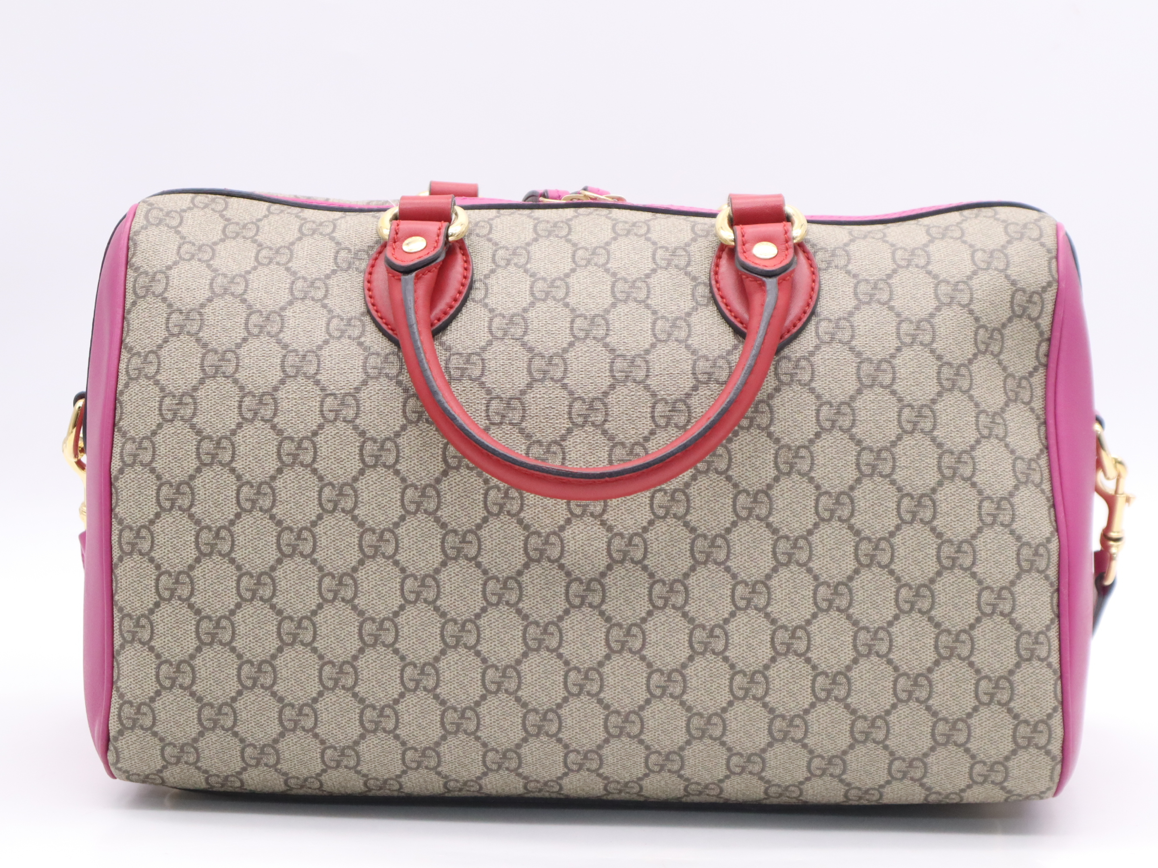 409527 GG Supreme 2-way Boston bag in beige, pink, and red with gold hardware and shoulder strap. — view 2