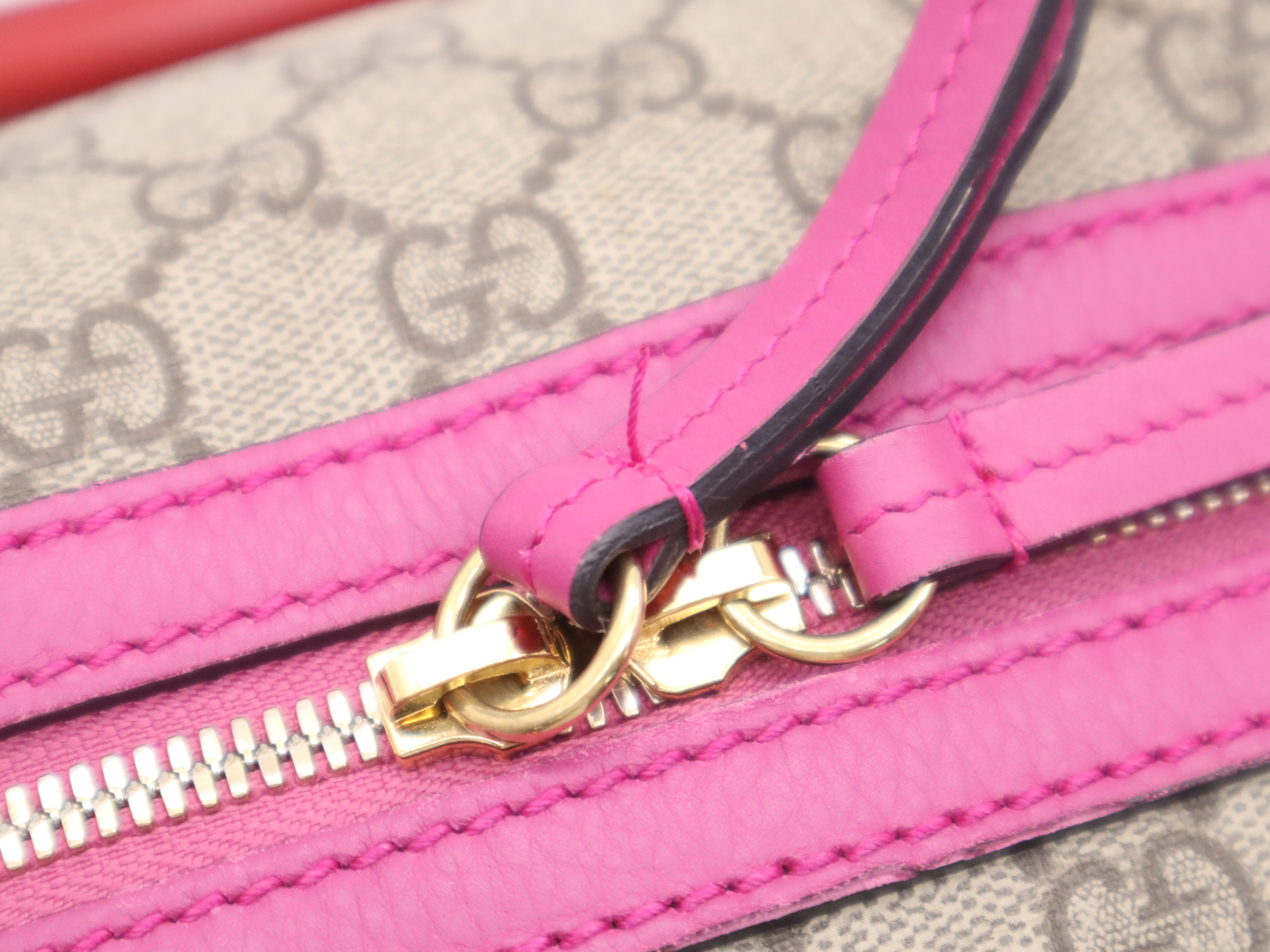 409527 GG Supreme 2-way Boston bag in beige, pink, and red with gold hardware and shoulder strap. — view 11