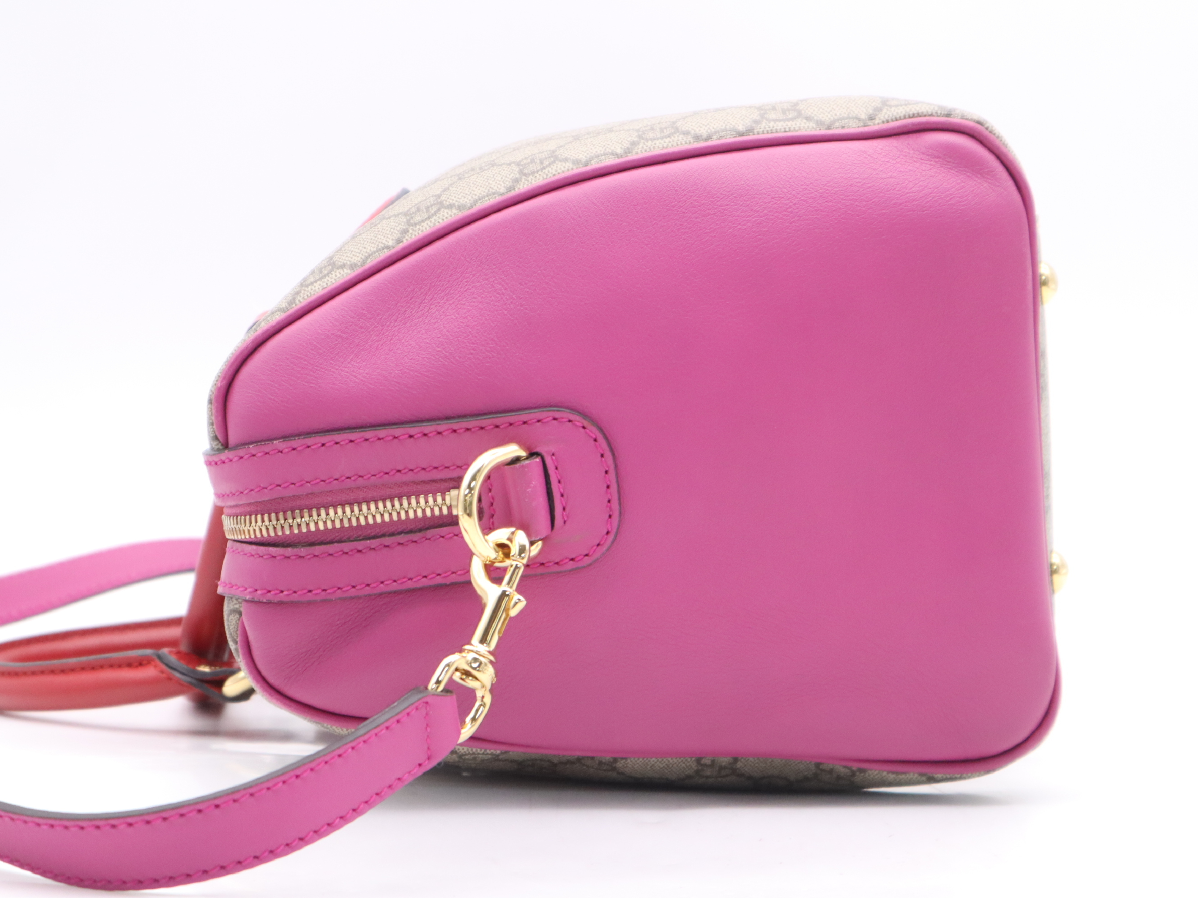 409527 GG Supreme 2-way Boston bag in beige, pink, and red with gold hardware and shoulder strap. — view 3