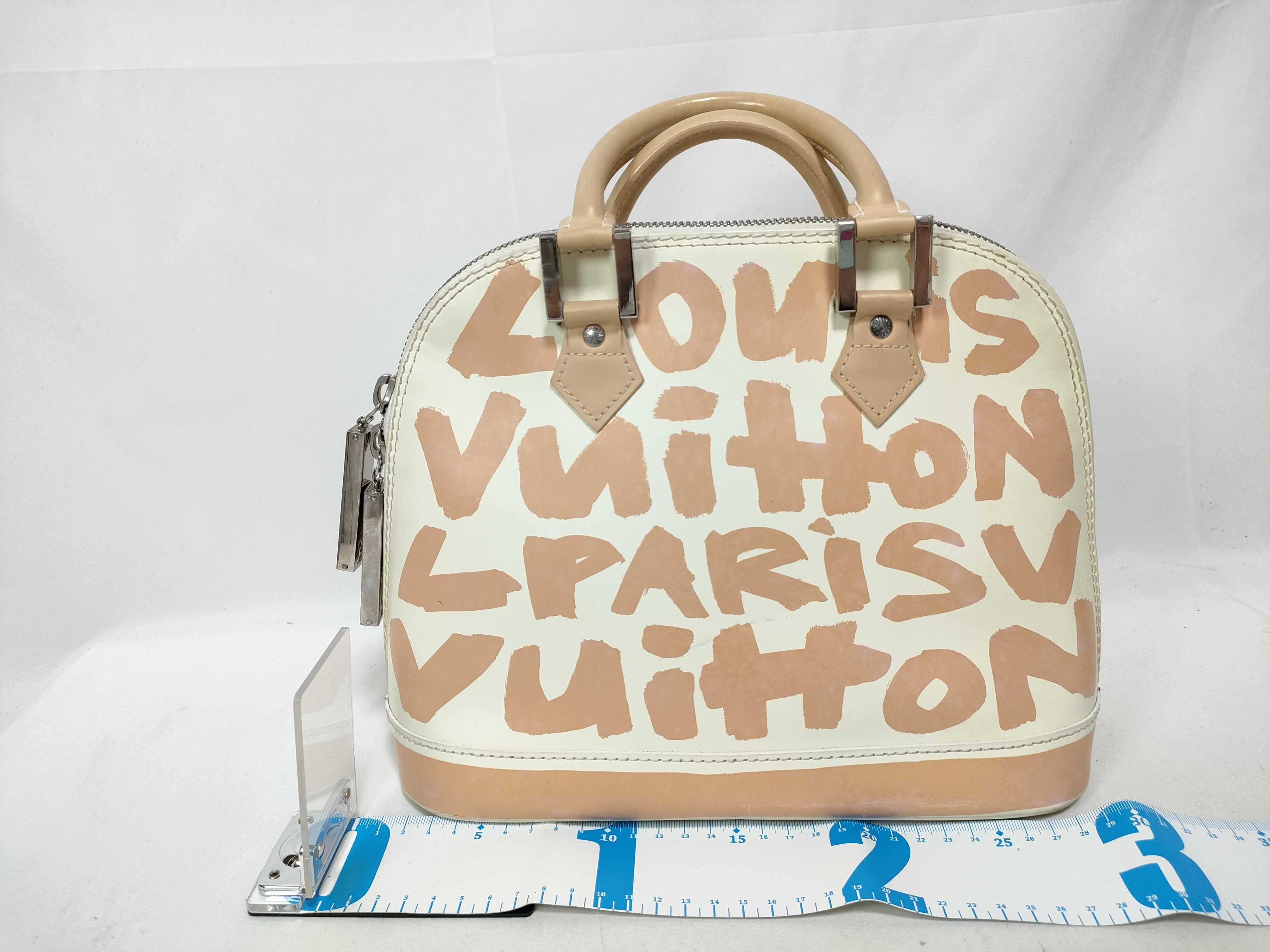 ID- Cow Skin Graffiti Alma MM M92180 white x orange BA0051 handbag — view 2