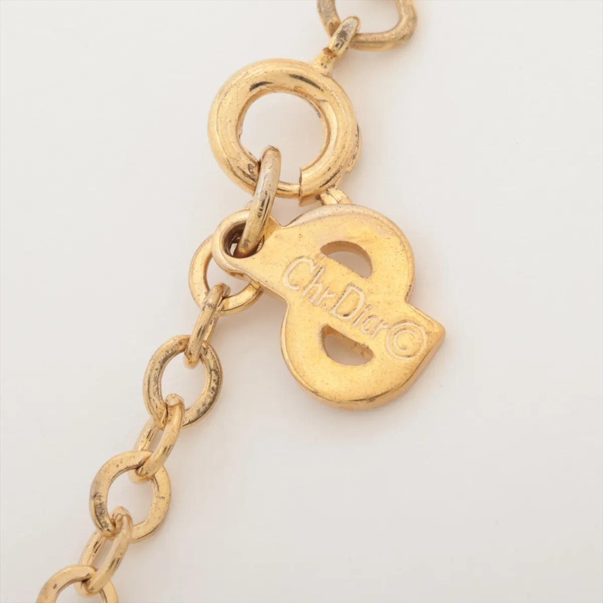 CD logo necklace, gold plated with rhinestones. Shows signs of wear, — view 4