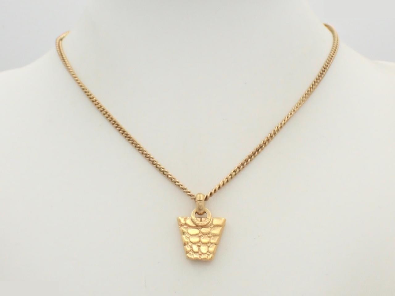 Gold necklace with a bag motif and approximately 42cm chain. — view 3