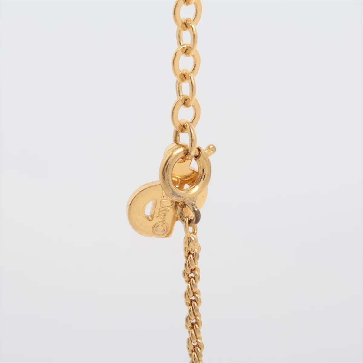 CD logo necklace, gold plated with rhinestones, shows signs of wear, tarnishing, — view 3