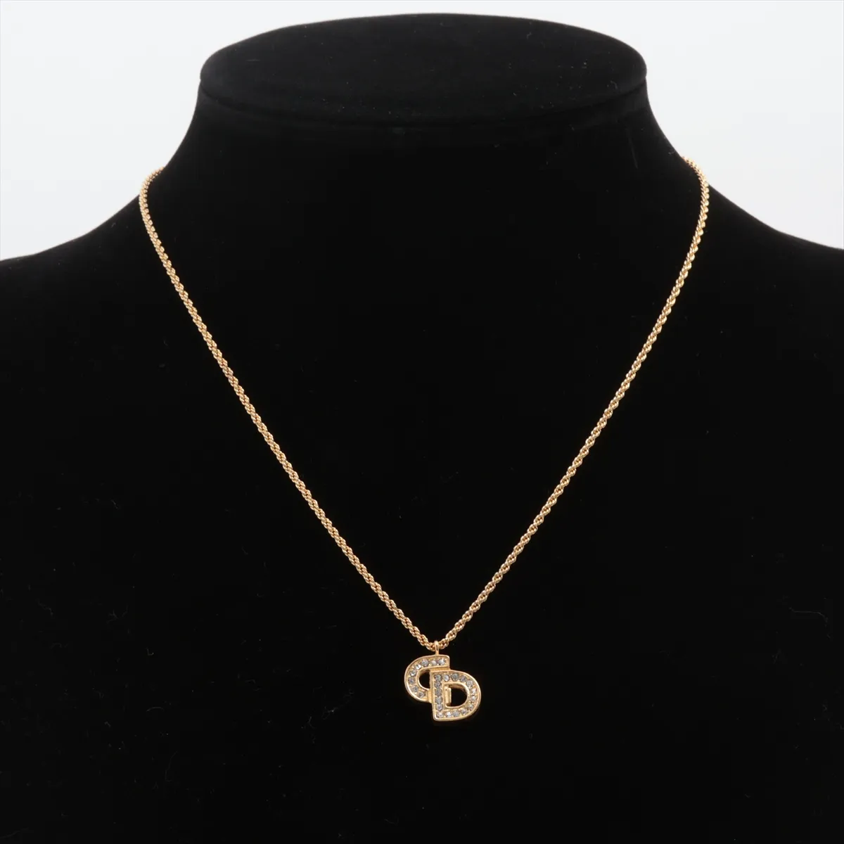 CD logo necklace, gold plated with rhinestones, shows signs of wear, tarnishing, — view 5